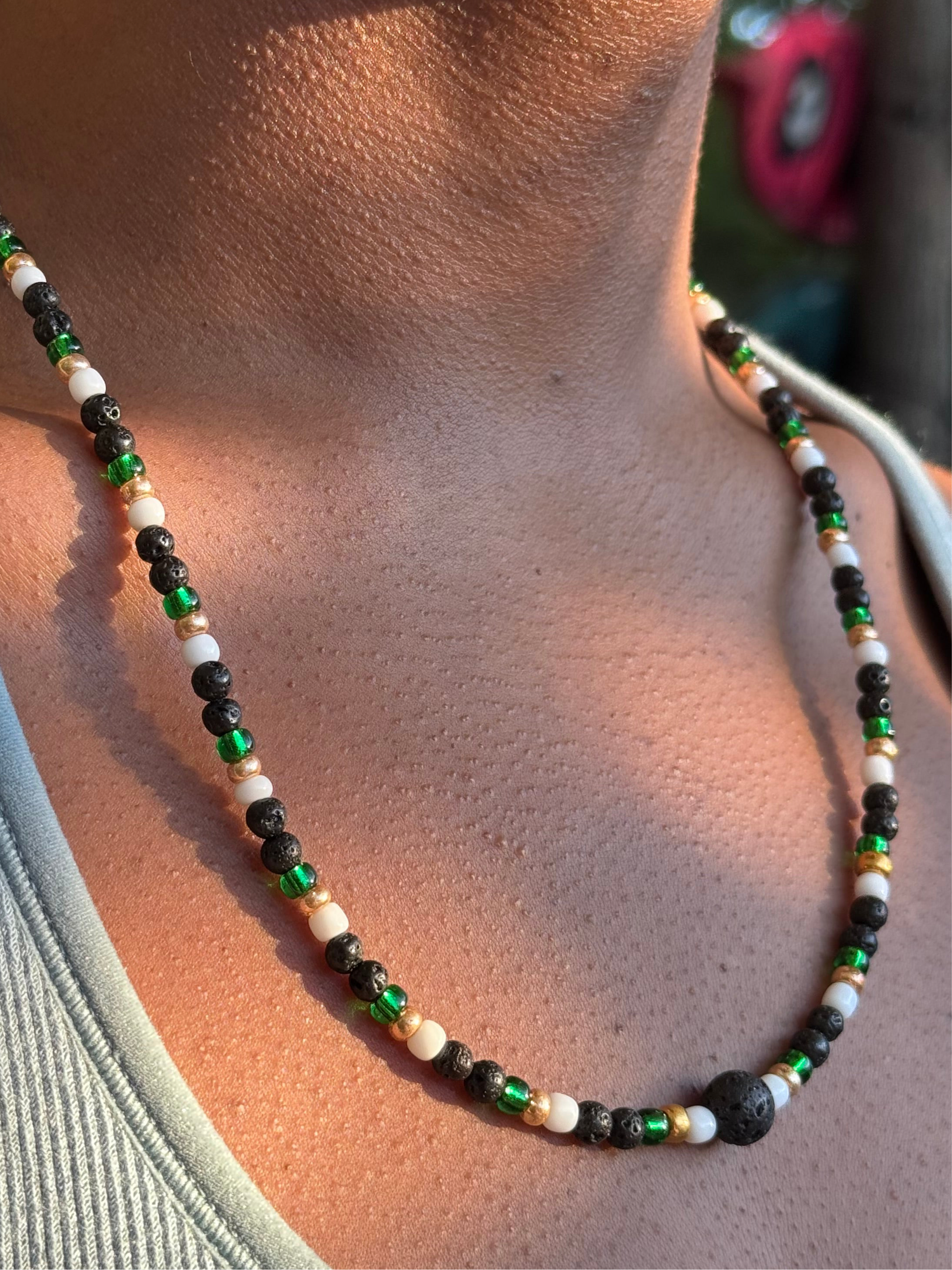 Necklace with multicolored beads on a person's neck