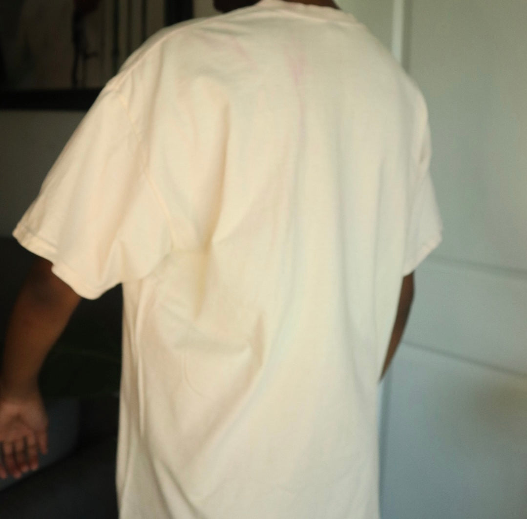 Person wearing a plain white t-shirt in an indoor setting