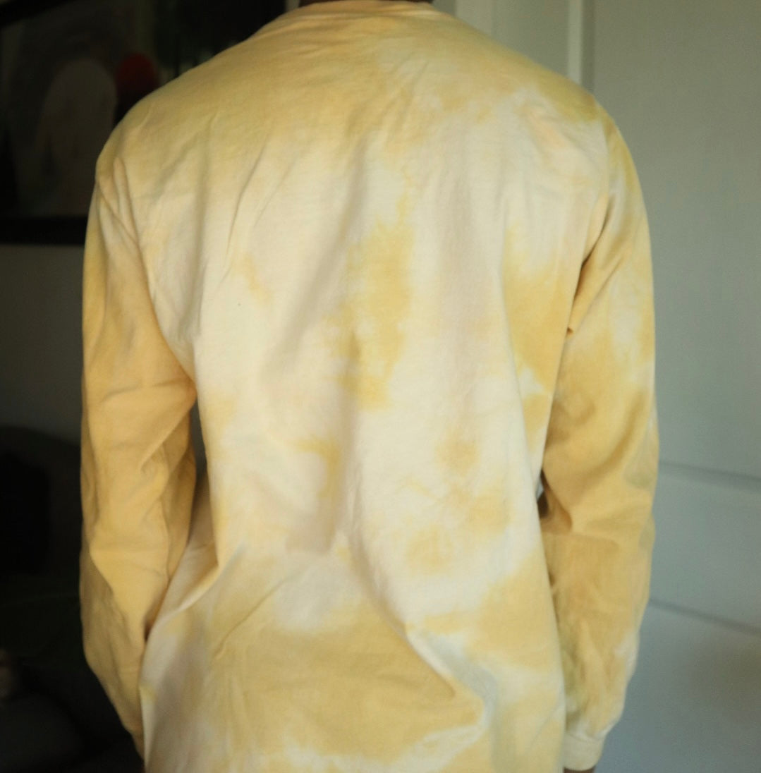 Yellow tie-dye shirt with a white background